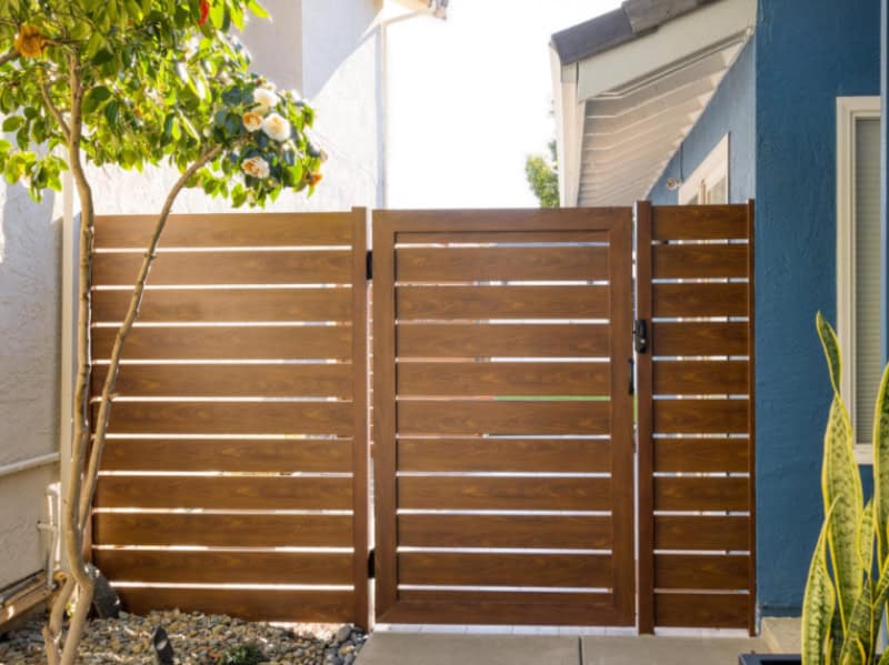 image of fire-safe aluminum fence with light wood pattern